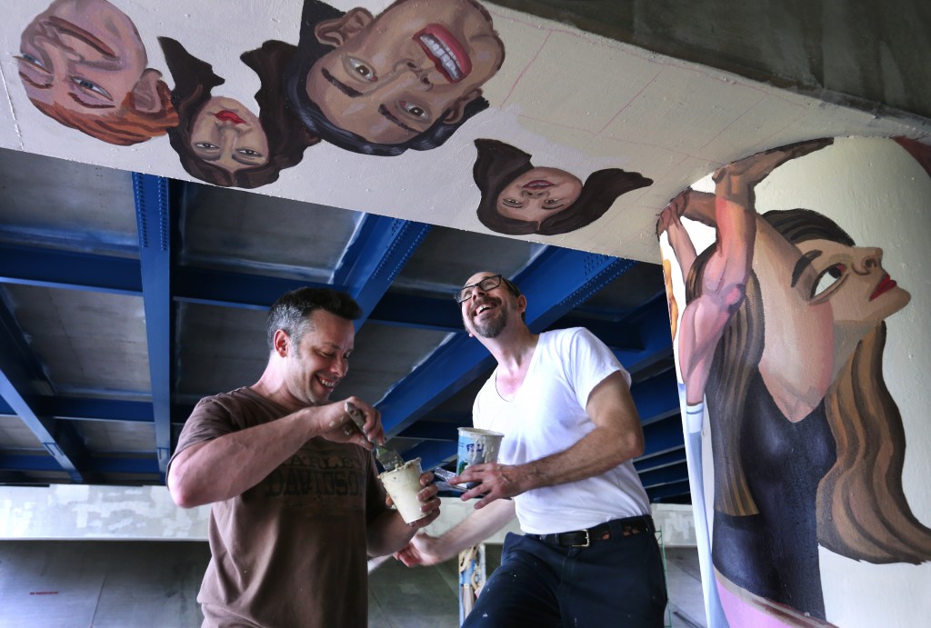 Tom and Assistant, Bill Pozzo painting Pillars of Society, 2015 14 x 280' acrylic on concrete photo by Charlie Nye / The Star Indystar Newspaper July 29, 2015